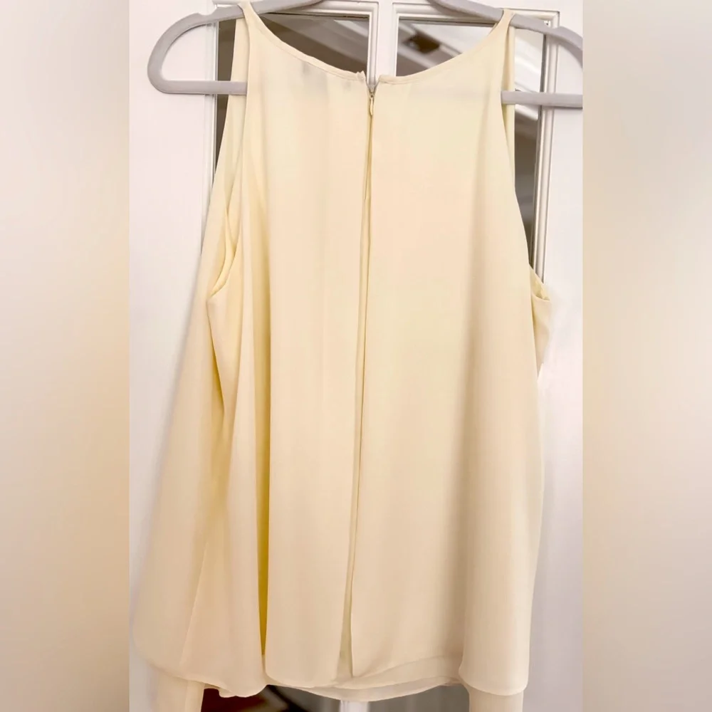 Sleeveless white blouse. Chiffon Layered bottom and longer back. Large - Picture 4 of 13